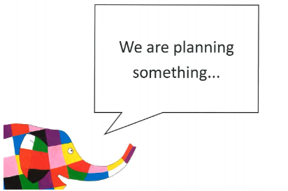 Elma the elephant with a speech bubble saying "We are planning something"